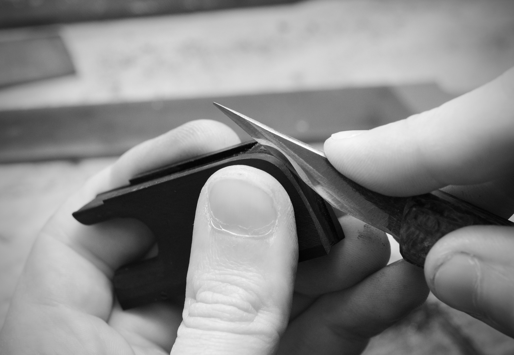 Preparing the heel plate channel for a cello frog at the bench