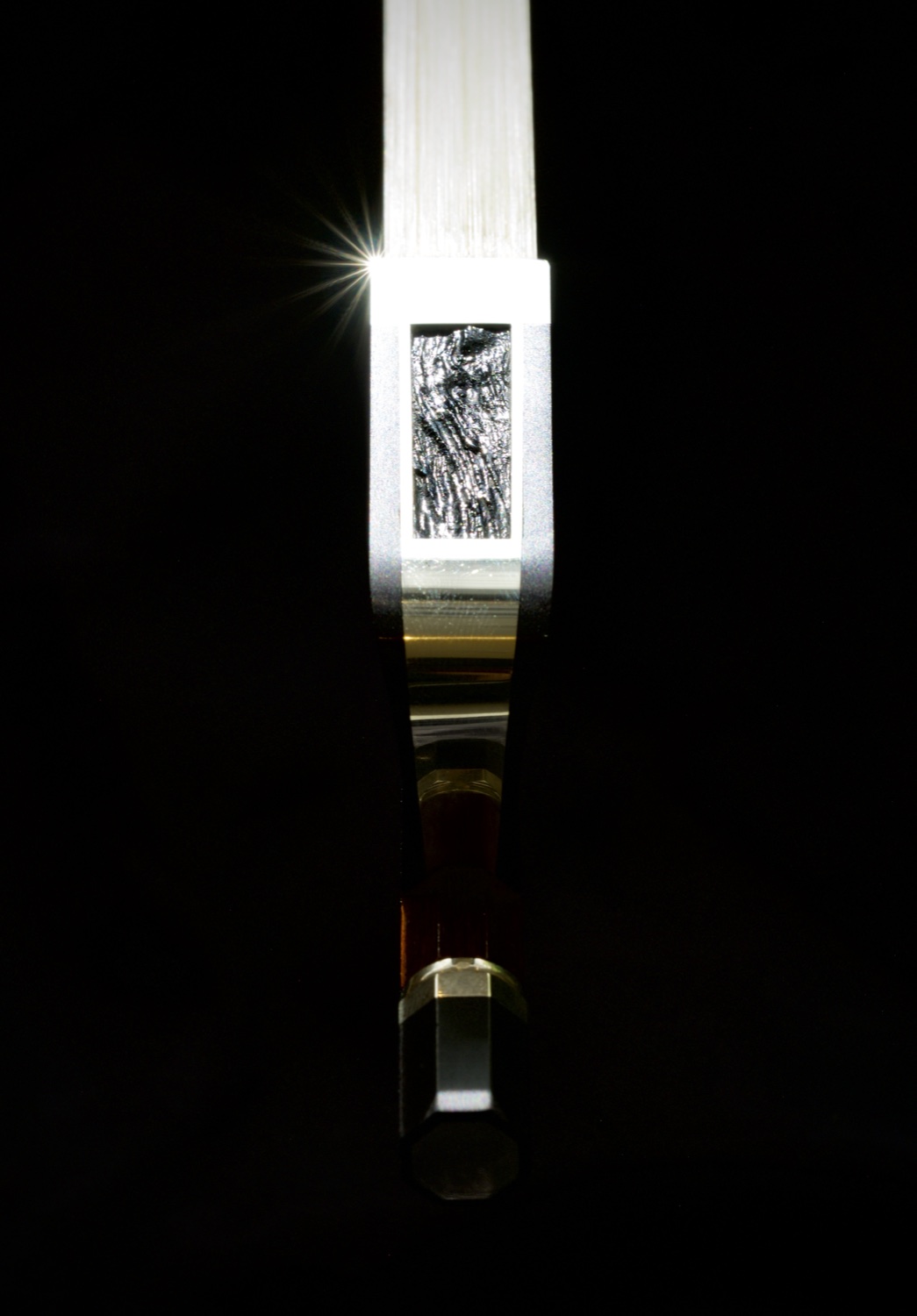 Op. 10 cello frog with raw ebony slide, backlit